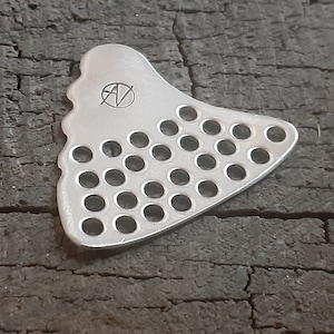 Sterling silver shark tooth guitar pick with holes for weight - playable
