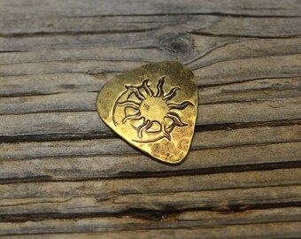 brass guitar pick - playable with sun and moon - hammered texture on back - non slip