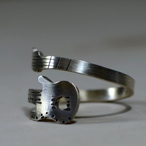 Guitar bypass ring rocking out in sterling silver