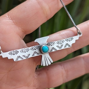 Sterling silver thunderbird necklace with 5mm turquoise from Kingman Mine