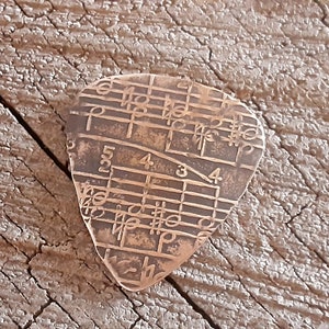 bronze guitar pick - playable with music notes - Limited Edition - NicisPicks Original - comes with stand and gift wrapped