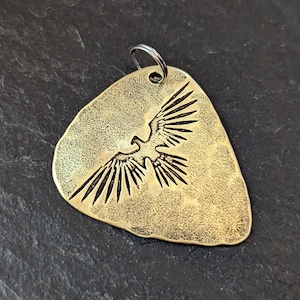 Thunderbird brass guitar pick pendant - playable metal plectrum - NicisPicks