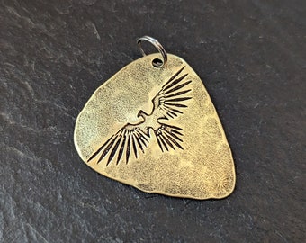 Thunderbird brass guitar pick pendant - playable metal plectrum - NicisPicks