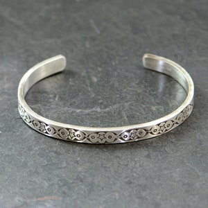sterling silver cuff bracelet with hand stamped southwestern pattern