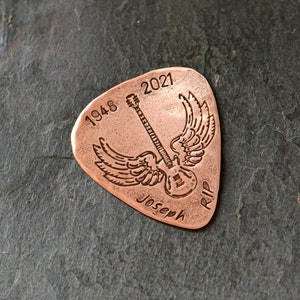 copper memorial guitar pick with winged guitar and small years and name - custom memory