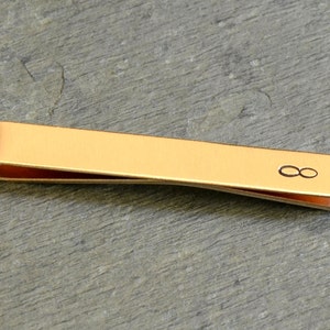 Brass tie bar with infinity sign for never ending love