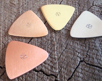 mixed bag of playable metal guitar picks in triangular shape - copper , brass , bronze and aluminum - QTY 4