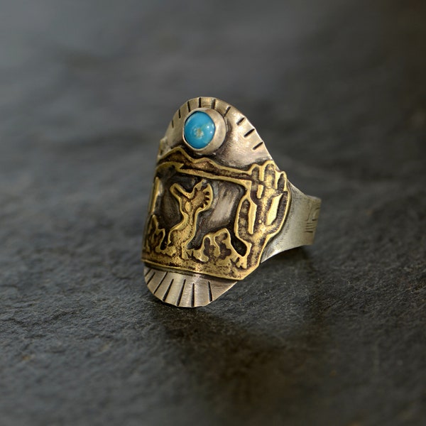 Silver cigar band ring with Kokopelli cactus and a 5mm Turquoise stone