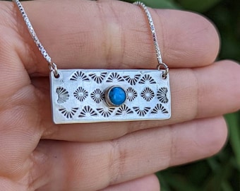 Sterling silver charm necklace hand stamped with pattern and 5mm Kingman mine turquoise