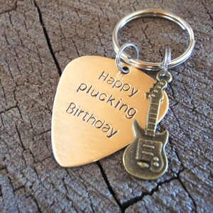 guitar pick keyring made from bronze with small brass guitar charm for birthday