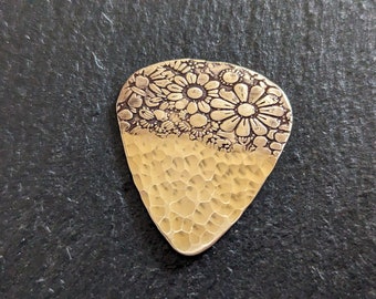 Bronze guitar pick with flowers and a sparkly hammered texture - playable