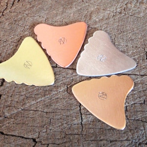 mixed bag of 4 different metal guitar picks shark tooth shape - playable