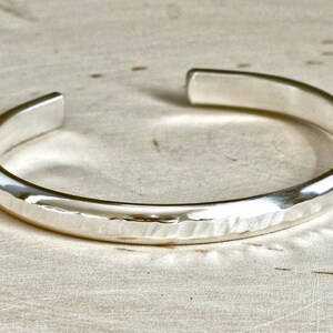 thick sterling silver cuff bracelet with hammered texture and sparkly finish
