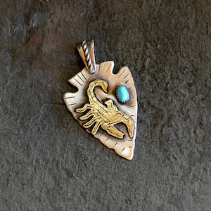 Sterling silver arrowhead pendant with brass scorpion and sleeping beauty turquoise