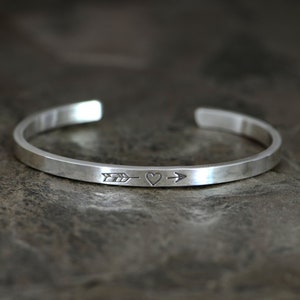 Dainty sterling silver heart and arrow cuff bracelet perfect for stacking