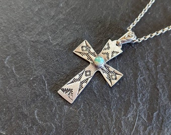 sterling silver cross pendant with stamped design and 5mm turquoise stone