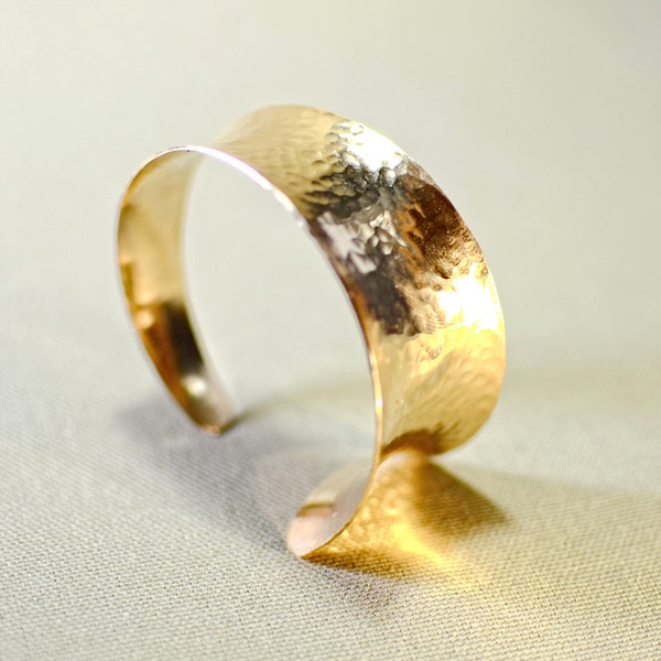 Hammered bronze chunky bracelet with asymmetrical anticlastic design and artistic taper