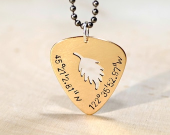 Custom cut out guitar pick necklace in 14k gold shown here with latitude longitude coordinates - NL479