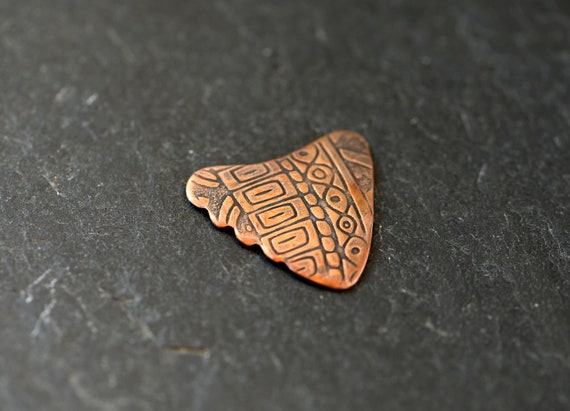 Copper shark tooth guitar pick - playable with non slip backside and a crazy pattern on front