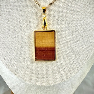 Handcrafted necklace with a cedar pendant.