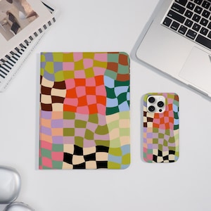 May include: A colorful, patterned phone case and tablet case. The cases feature a wavy checkerboard design in shades of pink, orange, green, blue, and black. The tablet case is rectangular, and the phone case is smaller and rectangular with a camera cutout.