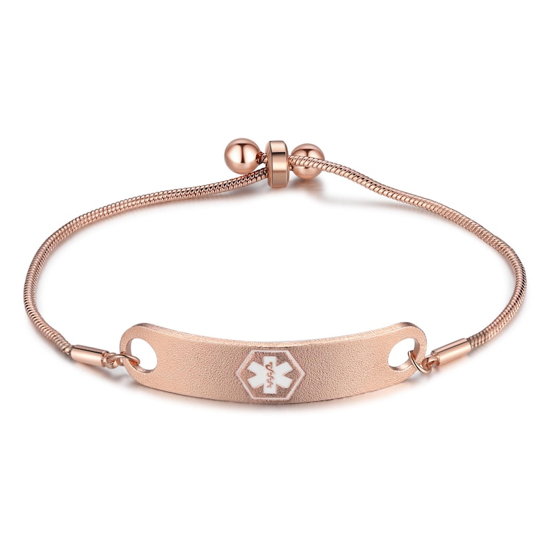 May include: Rose gold medical alert bracelet with a textured ID plate. The plate features a white medical symbol. The bracelet has a snake chain design and an adjustable clasp.
