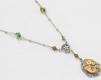 Steampunk Necklace Vintage gold watch movement with peridot green Swarovski crystal beads Victorian styled silver flower Statement necklace