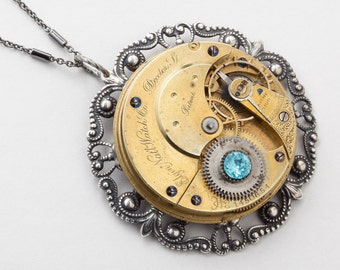 Steampunk Necklace Vintage Elgin gold pocket watch movement silver filigree bezel and blue crystal pendant necklace by Steampunk Nation