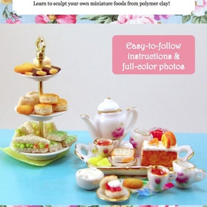 May include: A dollhouse miniature tea party food set with a three-tiered cake stand, a teapot, a tray of food, and a variety of miniature cakes, sandwiches, and pastries. The set is on a light blue surface. The text "Easy-to-follow instructions & full-color photos" is on a pink background. The text "Cooking School Series, vol. 1" is on a white background. The text "www.themousemarket.com" is on a white background.