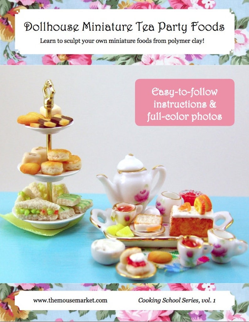 May include: A dollhouse miniature tea party food set with a three-tiered cake stand, a teapot, a tray of food, and a variety of miniature cakes, sandwiches, and pastries. The set is on a light blue surface. The text "Easy-to-follow instructions & full-color photos" is on a pink background. The text "Cooking School Series, vol. 1" is on a white background. The text "www.themousemarket.com" is on a white background.