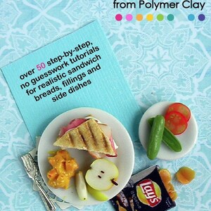 May include: How to Sculpt Miniature Sandwiches from Polymer Clay.  A close-up of a miniature sandwich on a white plate with a side of fruit and a bag of Lay's potato chips.  The image includes the text "over 50 step-by-step, no guesswork tutorials for realistic sandwich breads, fillings and side dishes" and "includes cute printables".