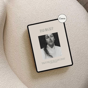 May include: An iPad mockup with a black frame displays a black and white photo of a woman. The text "IPAD MOCKUP" is at the top, and below the photo is text that reads "Elevate your brand visuals with this elegant iPad mockup designed to showcase your digital products, portfolios, or website designs."