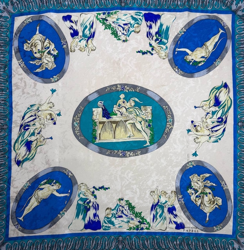 May include: Square silk scarf with a cream background and a blue border. The scarf features oval medallions with classical figures in blue and white, and a central oval with a detailed scene.
