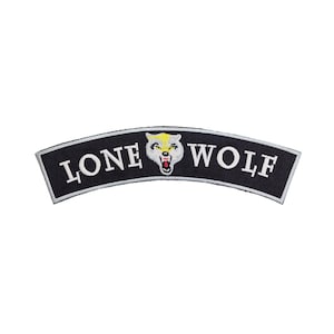 May include: Black, curved patch with white text reading "LONE WOLF". A snarling wolf head with yellow, white, and red accents is centered on the patch. The patch has a white border.