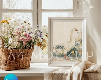 May include: A framed artwork featuring a goose in a field of flowers, displayed on a windowsill. A woven basket filled with colorful flowers sits to the left. The text "A4 Mockup" is visible on the image.