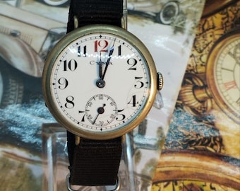 Cyma watch, circa 1910, red “12”, 32.7 mm case