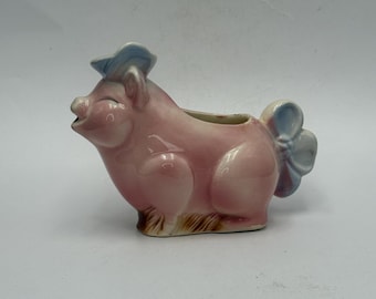 vintage Spaulding Royal Copley pink pig creamer featuring a blue beret and a bow-shaped handle