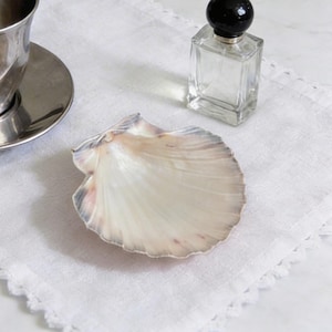 May include: A rustic wooden sign with the text "Welcome to our home" in white lettering. The sign features a distressed finish and a simple, inviting design, perfect for a front porch or entryway.