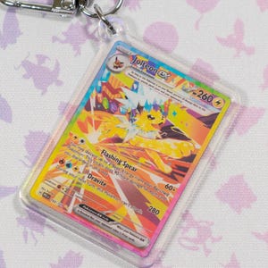 Porte-clés miniature en acrylique holographique Jolteon EX 153 Prismatic Evolution Pokémon TCG