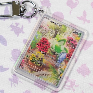 Porte-clés miniature en acrylique holographique Pokémon TCG Sprigatito 196 Paldea Evolved