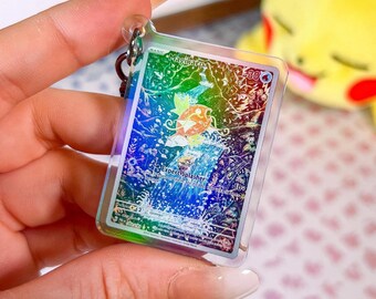 Miniature holographic acrylic keychain of Magikarp card 203 Paldea Evolved Pokémon TCG