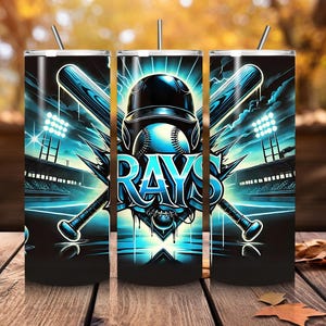 May include: A stainless steel tumbler with a graphic of a baseball player wearing a blue and white baseball cap with the word "RAYS" in blue and white letters. The graphic also includes two crossed baseball bats and a baseball.