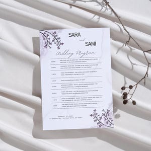 May include: A wedding program with a floral design in shades of purple and gray. The program lists the wedding ceremony and reception schedule, including the time, date, and location. The text reads "SARA and SAMI Wedding Program".