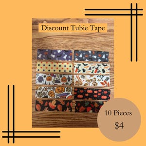 May include: A collection of ten decorative tubie tapes with various Halloween and autumn-themed patterns. The tapes feature designs like ghosts, pumpkins, and fall leaves. The text "Discount Tubie Tape" is displayed at the top.