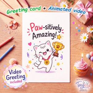 May include: A white greeting card featuring a colorful drawing of a white cat holding a gold trophy and wearing a gold medal. The text reads Paw-sitively Amazing! The card is surrounded by colored pencils, a gift box, daisies, and a cupcake with a candle.