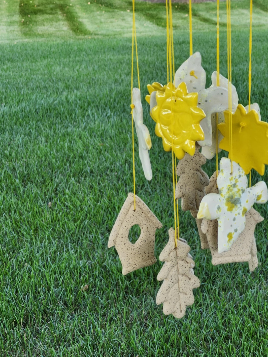 Image showcasing Handcrafted Ceramic Bird Flight Wind Chime: Nature-inspired Garden ...