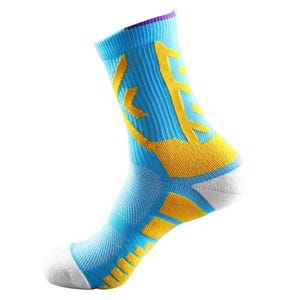 May include: A single athletic sock in a vibrant colour scheme. The sock features a light blue base with yellow accents and a white toe. The design includes a yellow graphic on the side and a purple trim at the top.