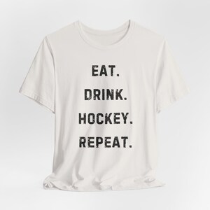 Eat. Drink. Hockey. Repeat. Unisex T-Shirt