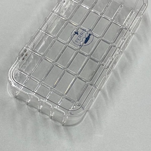 May include: A clear plastic tackle box with a gridded interior and a Ferris logo. The box is designed for storing fishing lures and other small fishing gear.