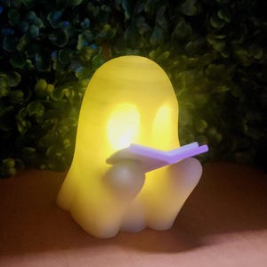 Glow-in-the-Dark Ghost Reading Figure: Spooky Halloween 3D Print